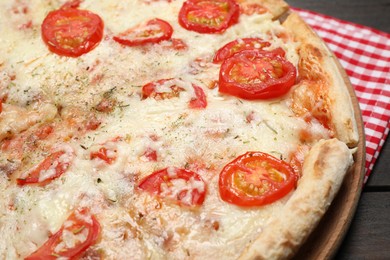 Photo of Delicious pizza Margherita on wooden table, closeup
