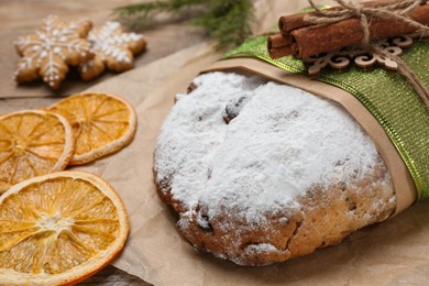 Decorated traditional Christmas Stollen on table, closeup