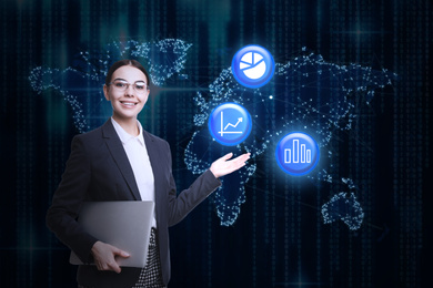 Young businesswoman holding laptop near virtual screen with world map and different icons. Finance trading concept