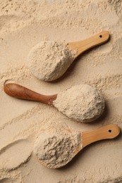 Buckwheat flour and wooden spoons, top view