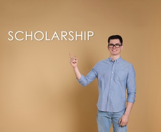 Image of Scholarship concept. Portrait of happy student on beige background