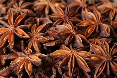 Aromatic anise stars as background, closeup view