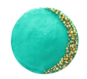 Delicious spirulina cheesecake decorated with pistachios isolated on white, top view