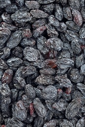 Tasty raisins as background, top view. Healthy dried fruit