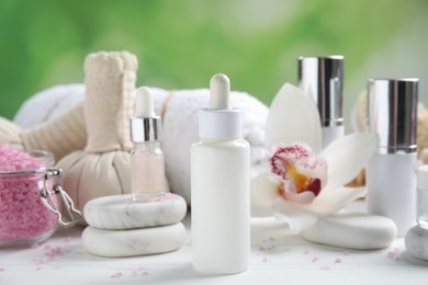 Photo of Composition with spa cosmetic on white wooden table