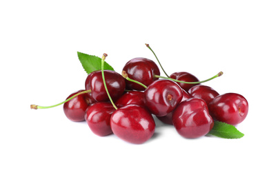 Tasty ripe red cherries with green leaves isolated on white