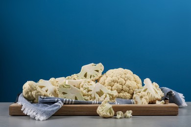Photo of Fresh raw cauliflower on light grey table