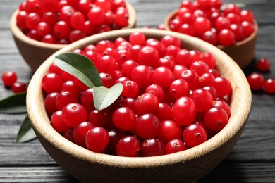 Ripe fresh cranberry on grey wooden table, closeup