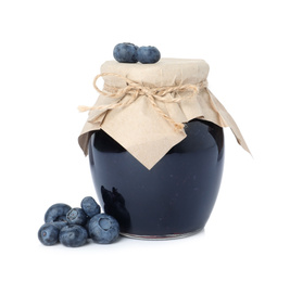 Jar of blueberry jam and fresh berries on white background
