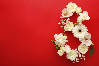 Number 8 made of beautiful white flowers on red background, flat lay with space for text. International Women's day