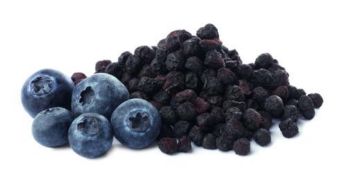 Sweet sublimated and fresh blueberries on white background