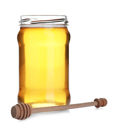 Jar of organic honey and dipper isolated on white