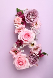 Number 8 made of beautiful flowers on violet background, flat lay. International Women's day