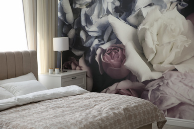 Beautiful floral photoart work used as wallpaper in bedroom interior