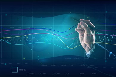 Businessman drawing growth graph on virtual screen, closeup. Investment concept