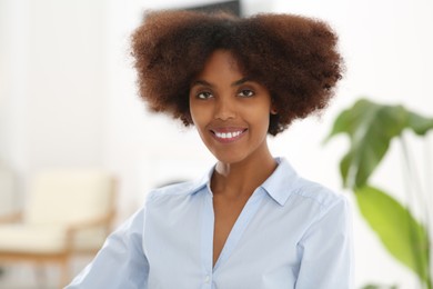 Photo of Portrait of smiling African American woman indoors