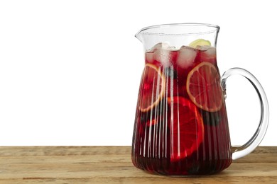 Glass jug of Red Sangria on wooden table against white background. Space for text