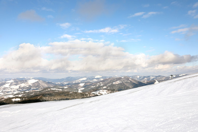 Photo of Picturesque mountain landscape with snowy hills in winter