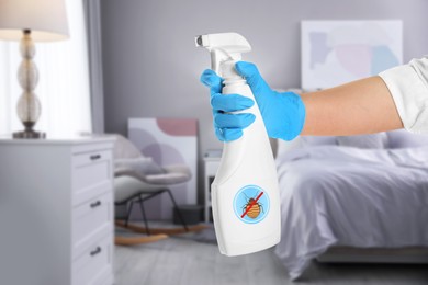 Image of Woman with anti bed bug spray in bedroom, closeup