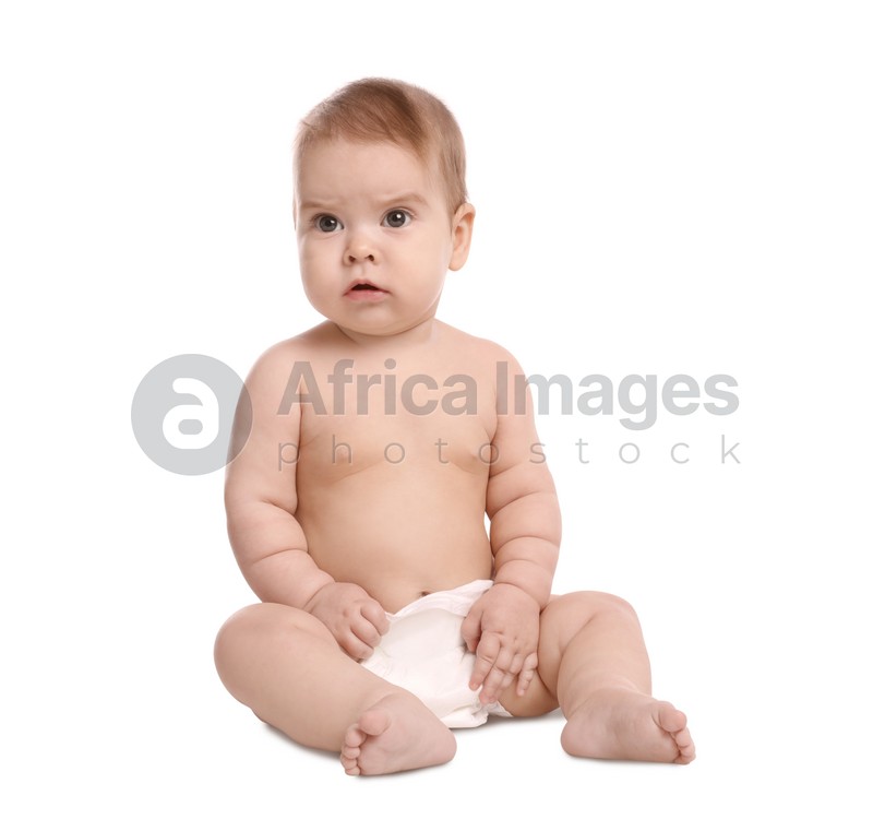 Cute little baby in diaper sitting on white background