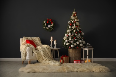Beautiful Christmas themed photo zone. Cozy living room interior imitation