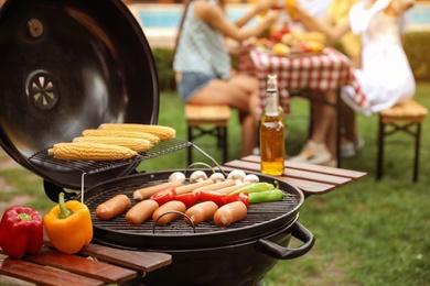 Barbecue grill with tasty fresh food outdoors