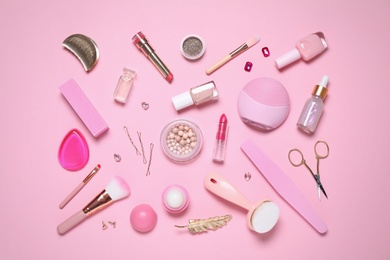 Flat lay composition with personal care products on pink background