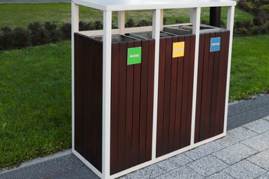 Different sorting bins for waste recycling outdoors