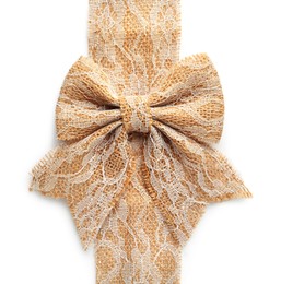 Bow and strip of burlap fabric with lace on white background