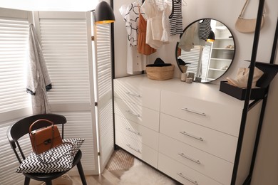 Closet interior with storage rack for clothes and accessories