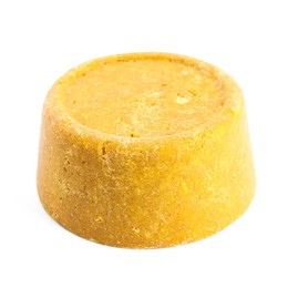 Yellow solid shampoo isolated on white. Hair care