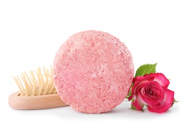 Photo of Solid shampoo bar, hairbrush and rose on white background. Hair care
