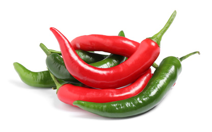 Photo of Ripe hot chili peppers on white background