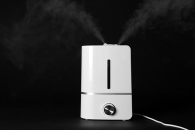 New modern air humidifier on black background