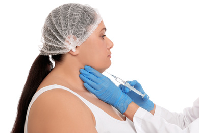 Woman with double chin getting injection on white background. Cosmetic surgery