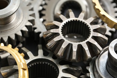 Photo of Many different stainless steel gears as background, closeup
