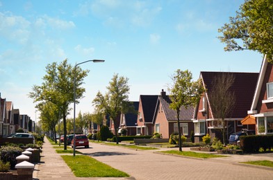 Photo of Block of houses on sunny day. Suburban district