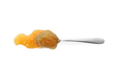 Delicious orange marmalade and spoon on white background, top view