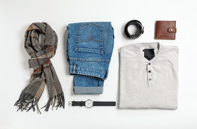 Flat lay composition with male winter clothes on white background