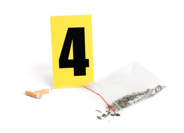 Cigarette stubs, cannabis and crime scene marker with number four isolated on white
