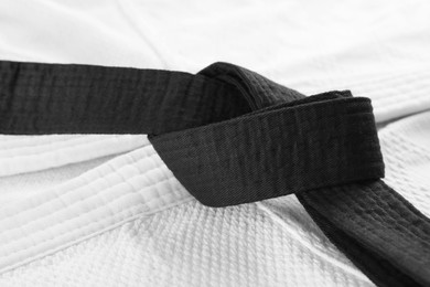 Black belt on white kimono, closeup view