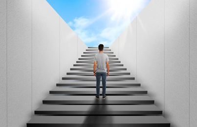Man standing on stairs and looking forward. Way to success