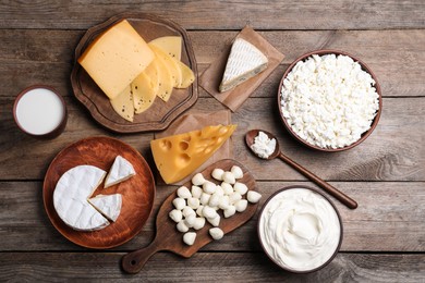 Flat lay composition with dairy products on wooden table