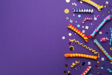 Flat lay composition with carnival items on purple background. Space for text