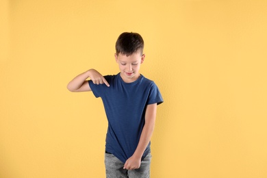 Little boy in t-shirt on color background. Mock-up for design