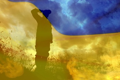 Silhouette of soldier and Ukrainian national flag, double exposure