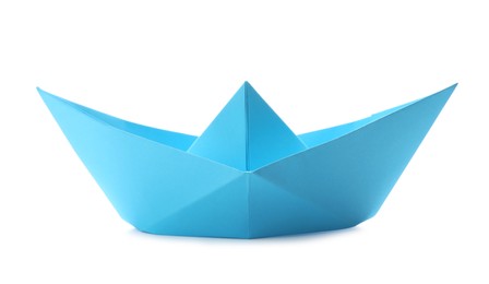 Handmade light blue paper boat isolated on white. Origami art