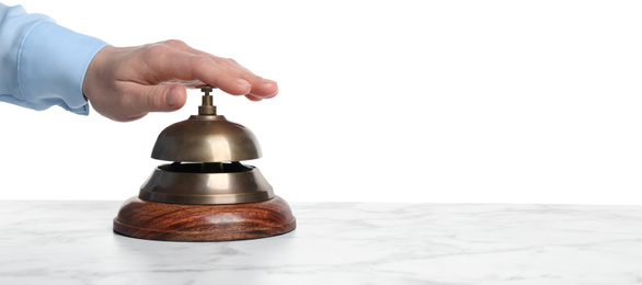 Man ringing hotel service bell at white marble table