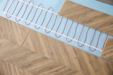 Installation of modern underfloor trace heating system indoors, top view