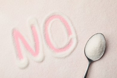 Word No made of sugar and spoon on pink background, top view